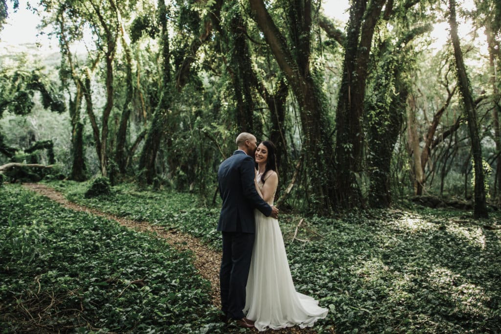 Maui jungle wedding couple hugging