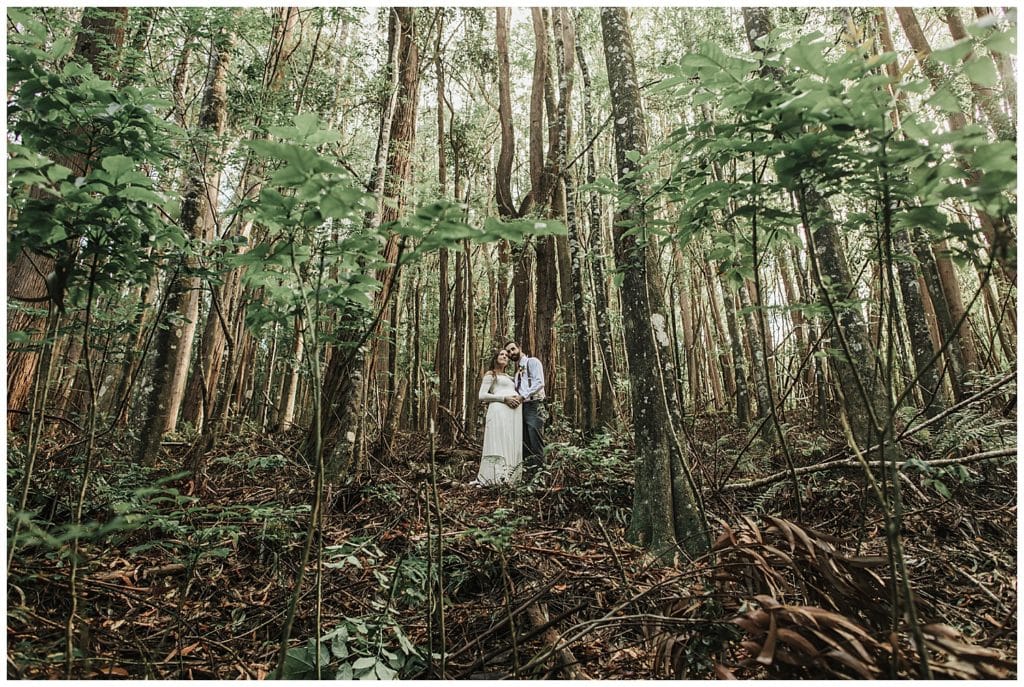 Boho wedding in Hawaii maui, couple kissing and walking and getting married