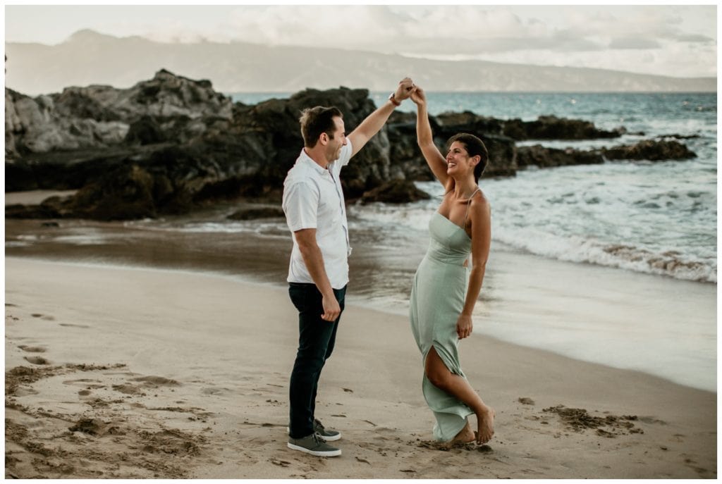 Maui proposal photographer Amy Jayne Photography captured this surprise proposal in Kapalua Maui on the cliffs with the couple on the beach