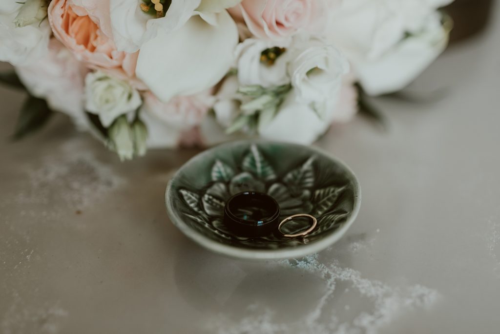 Detail shot of wedding bands in plate