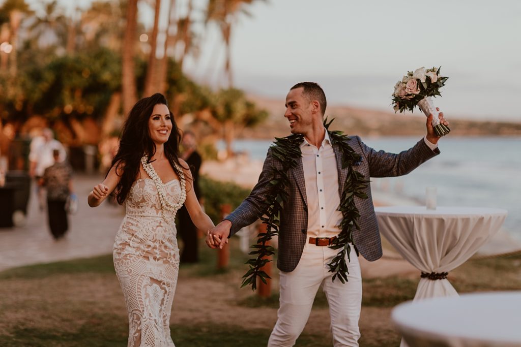 Bride and Groom holding hands walking together