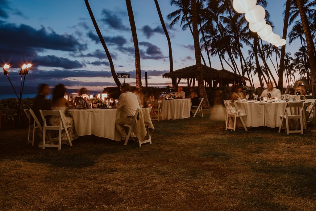 Shot of guests sitting at Reception tables at dawn