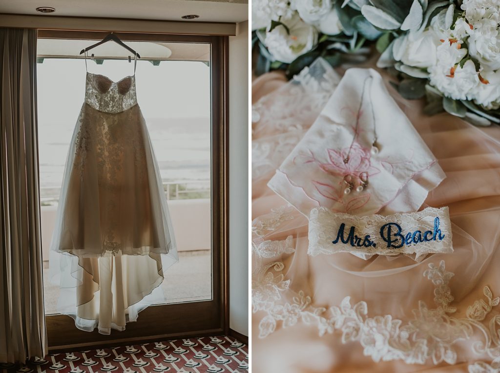 Detail shot of wedding dress hanging on glass door