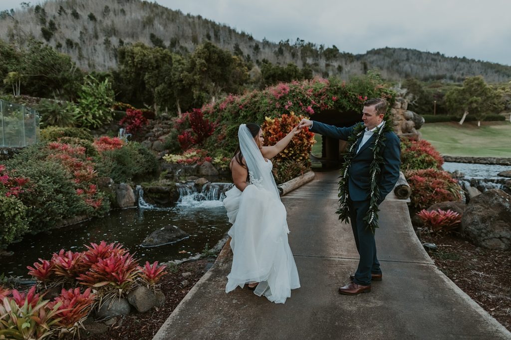 Bride and Groom dancing by golf course water area
