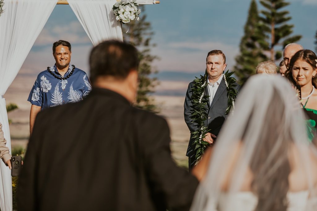 Groom watching Bride enter Ceremony