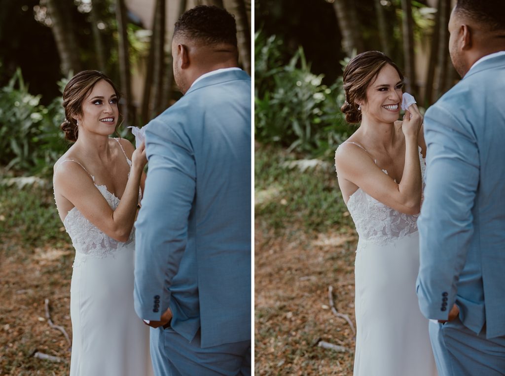 Bride smiling and wiping tears after First Look