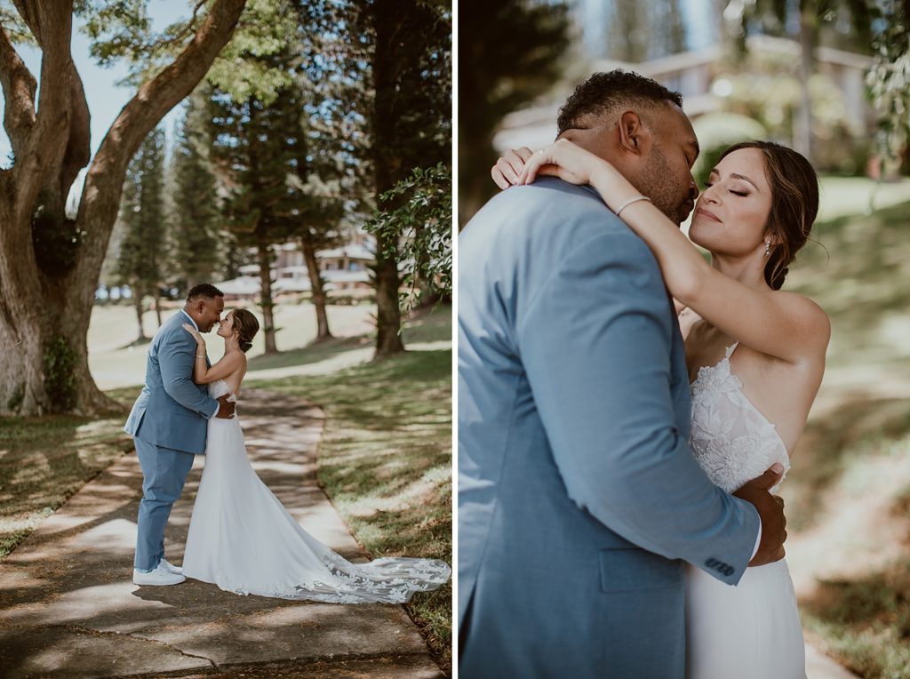 Bride and Groom holding each other on sidewalk