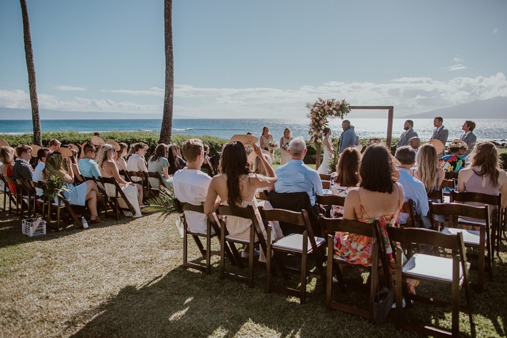 Wide shot of guests watching wedding Ceremony