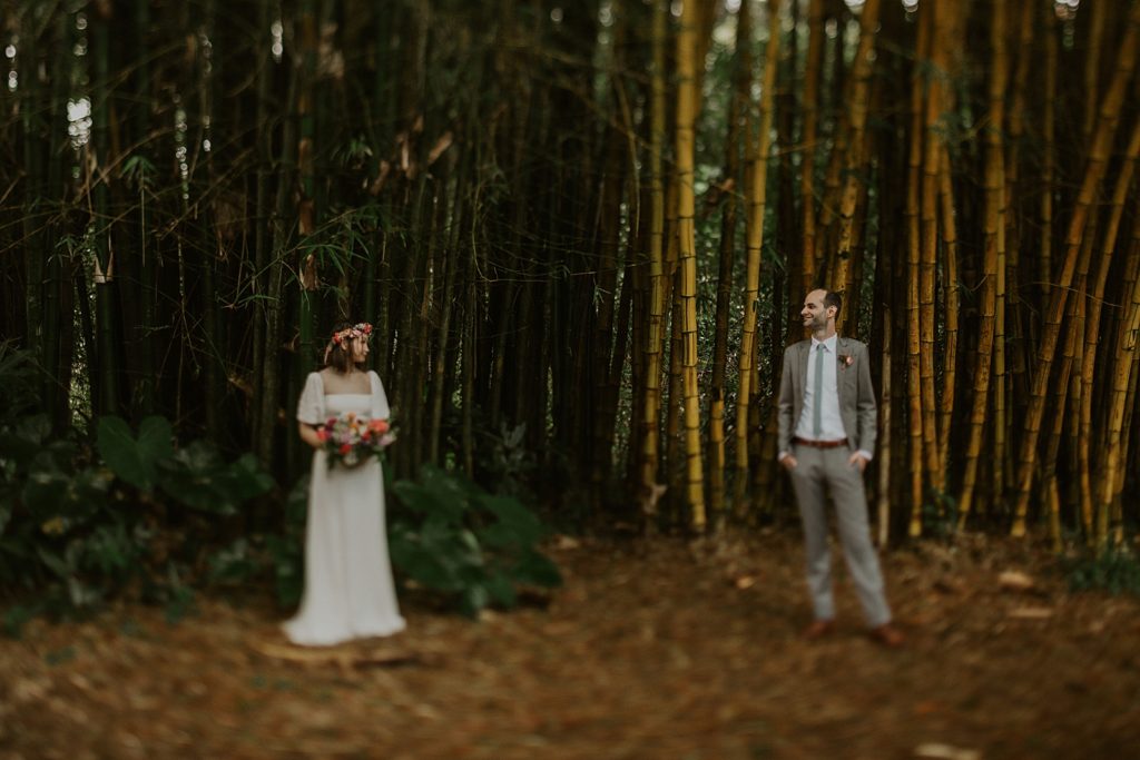 Bride and Groom standing from a distance looking from a distance