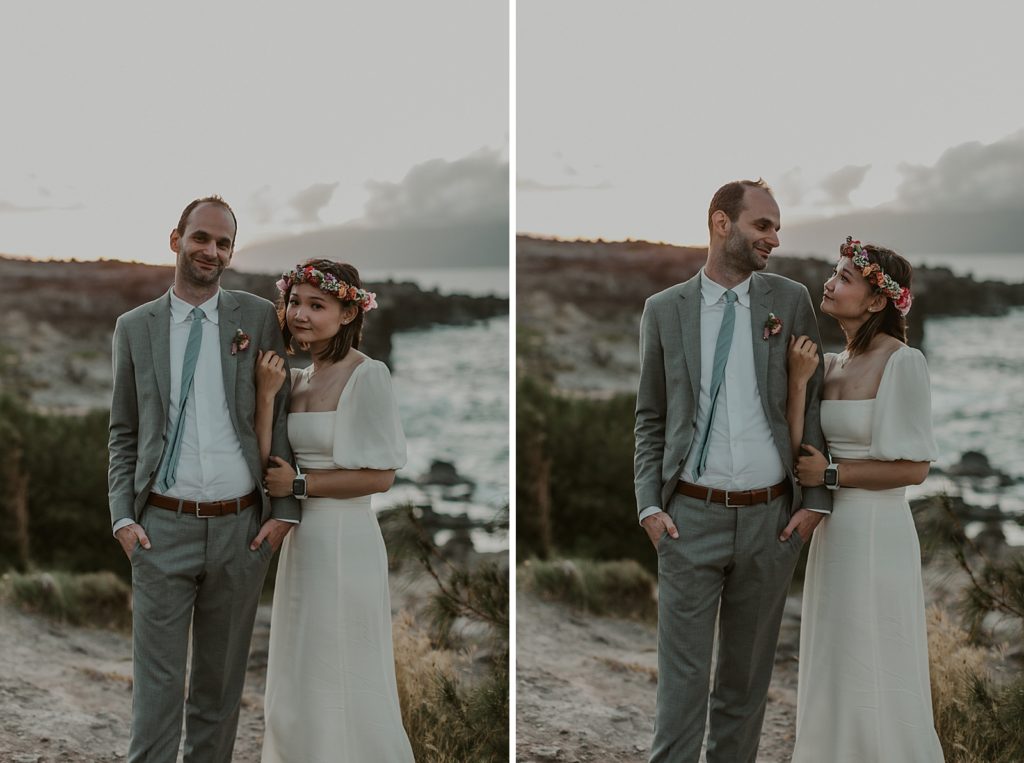Bride holding Groom's arm on cliffside