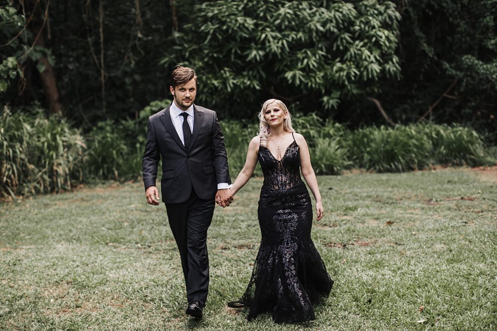 Bride and Groom holding hands and walking