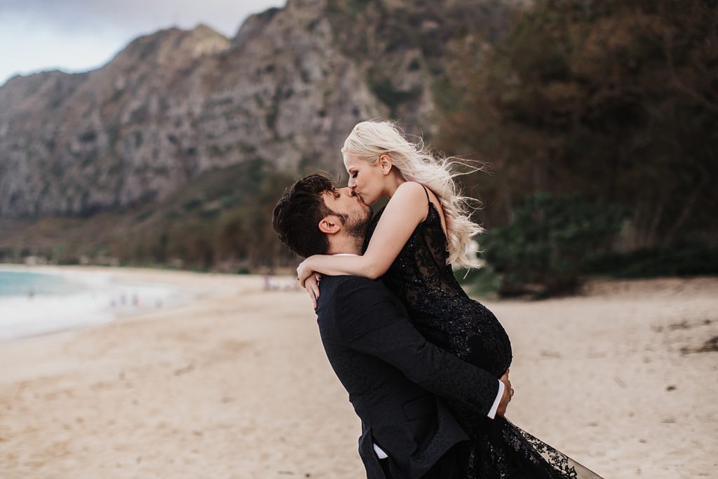 Groom holding Bride and kissing