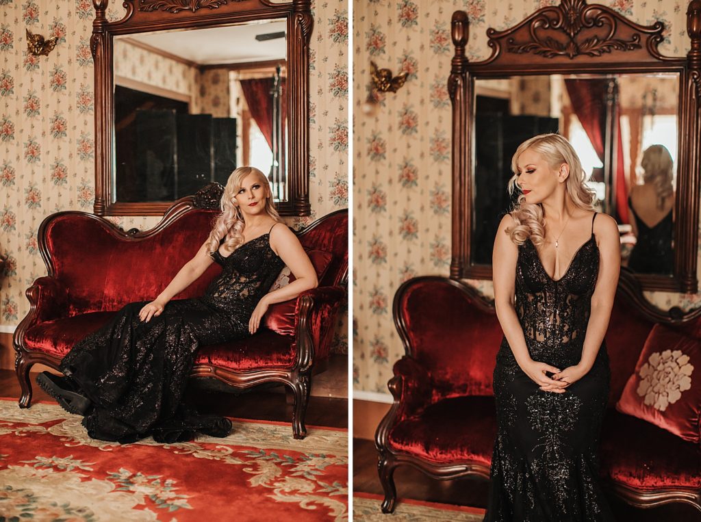 Bride in black sparkling dress lounging on red sofa