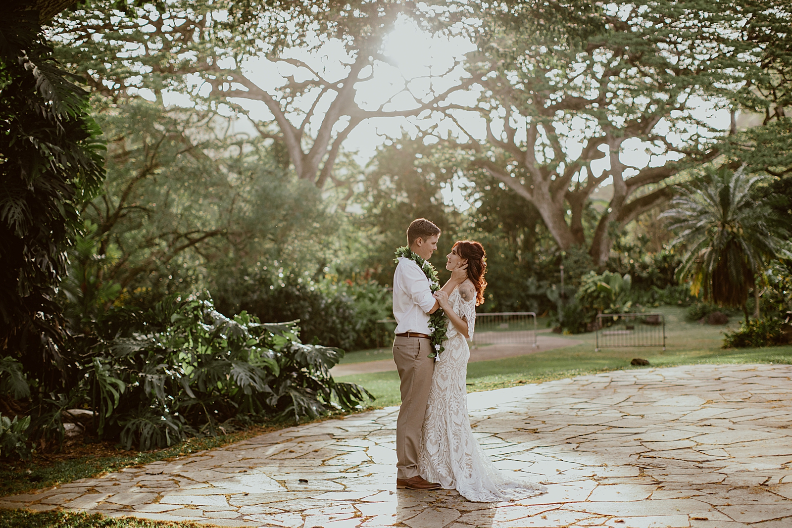 Bride and Groom holding each other and looking into their eyes outside