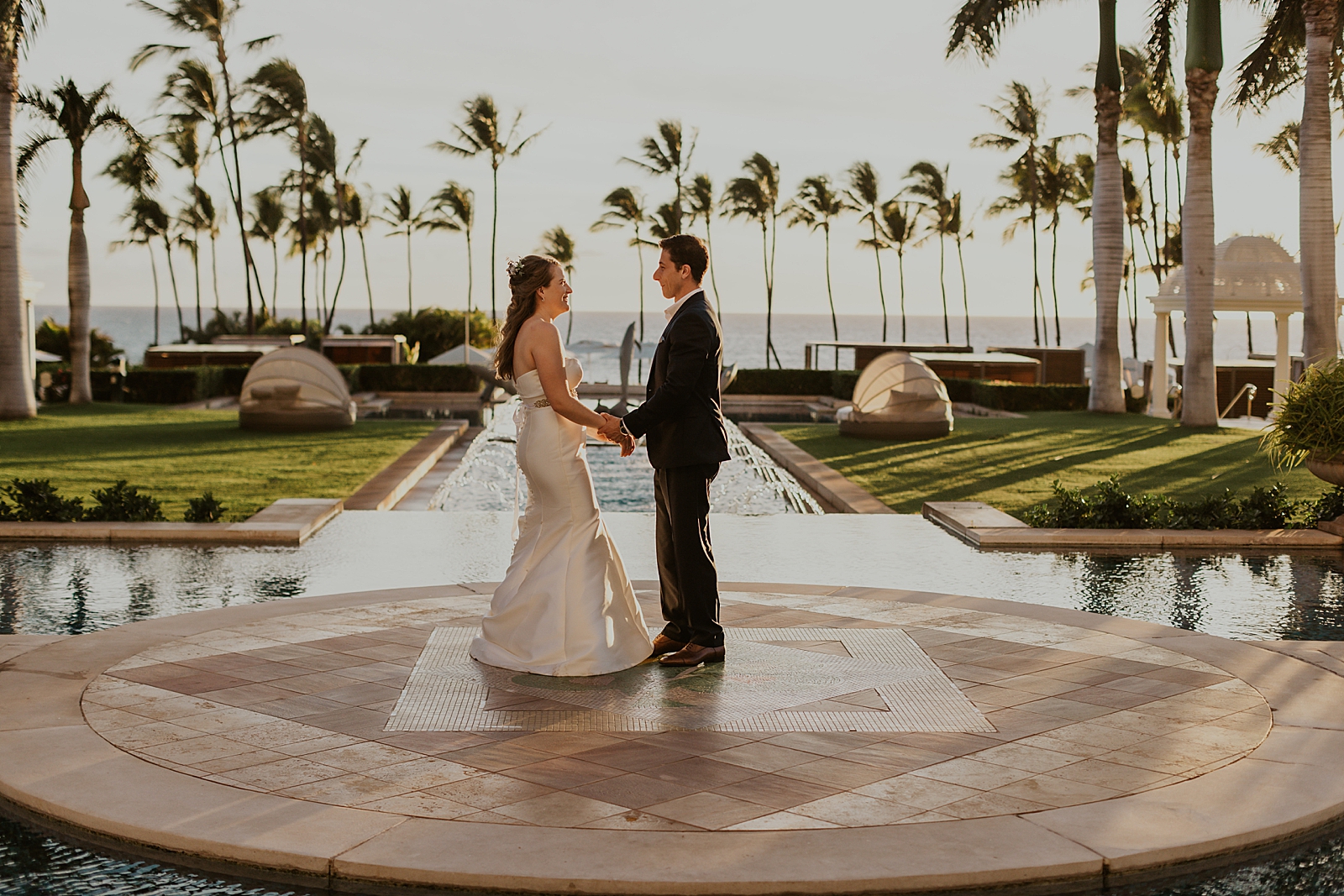 Bride and Groom standing in center of water fountain area