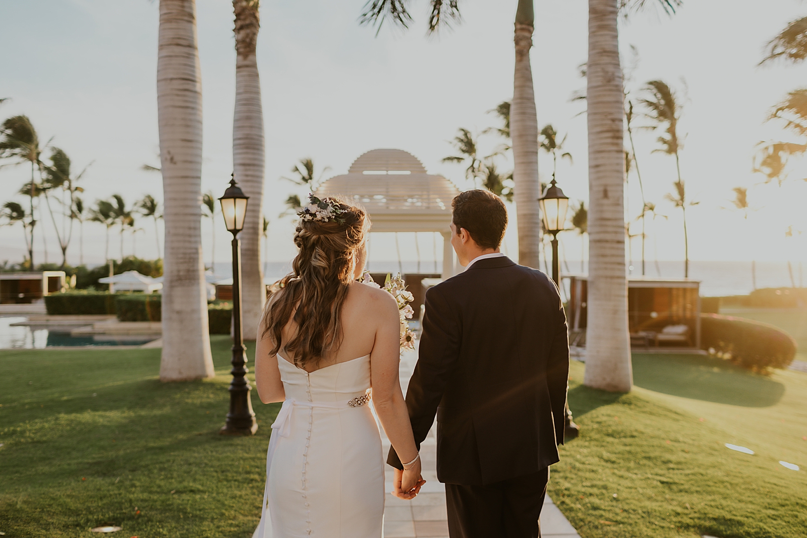 Bride and groom holding hands