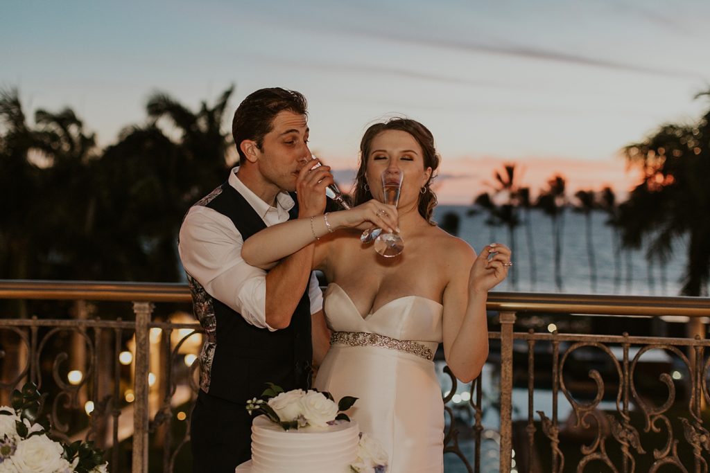 Bride and Groom giving each other a sip of champaign