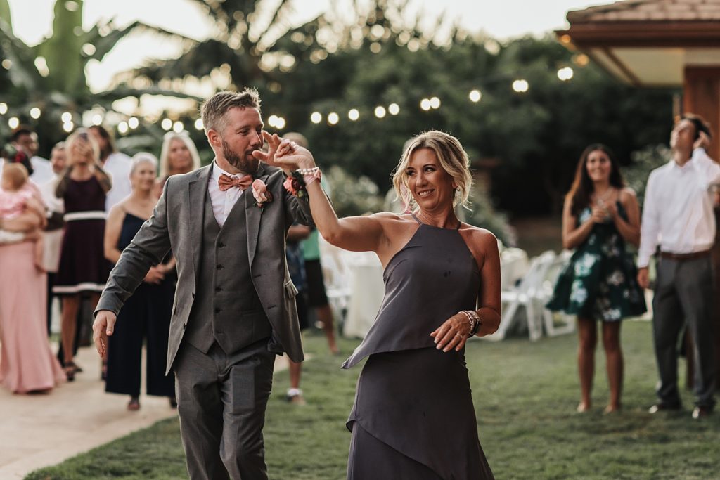 Mother son dance at Reception with guests watching