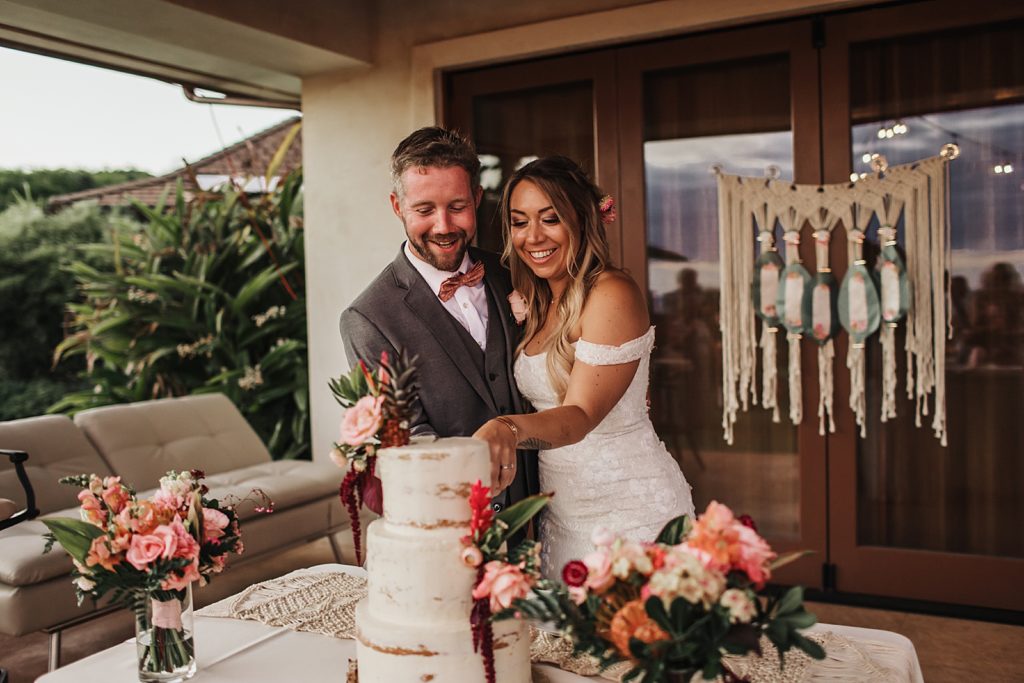 Bride and Groom about to cut wedding cake together
