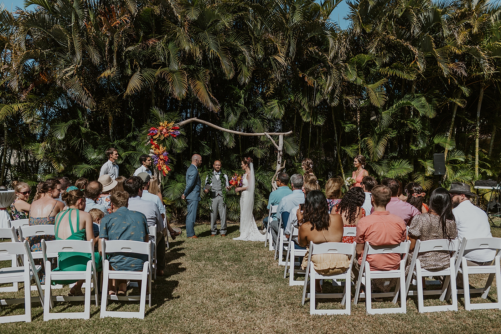 Wide shot of Bride and Groom face to face for outdoor Ceremony Homily