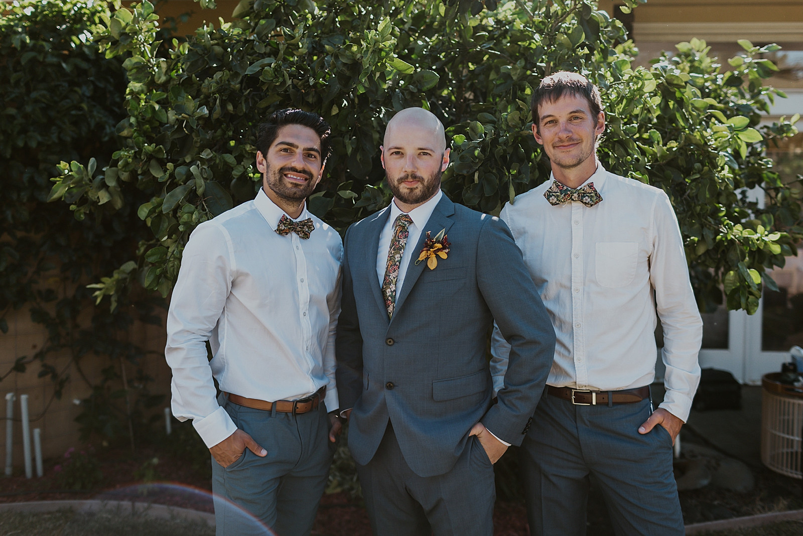 Groom with coat-less Groomsmen outside
