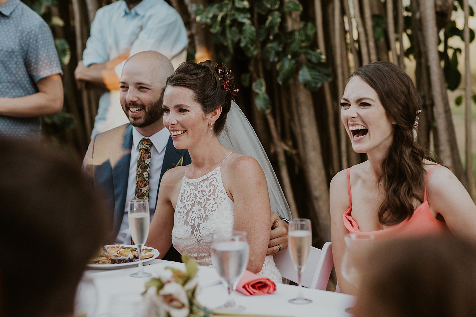 Bride and Groom listening to speeches at Reception