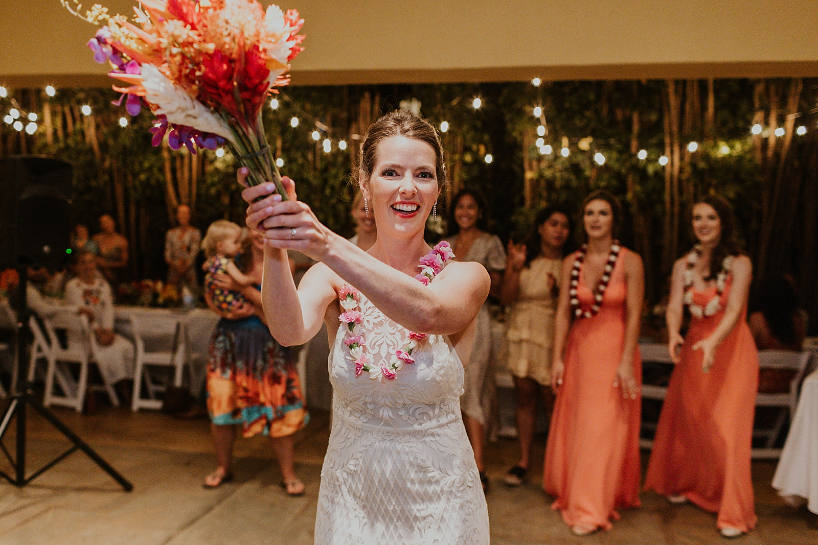 Bride getting ready to toss bouquet at Reception