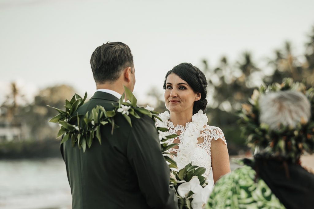 Closeup of Bride looking at Groom outside on the beach