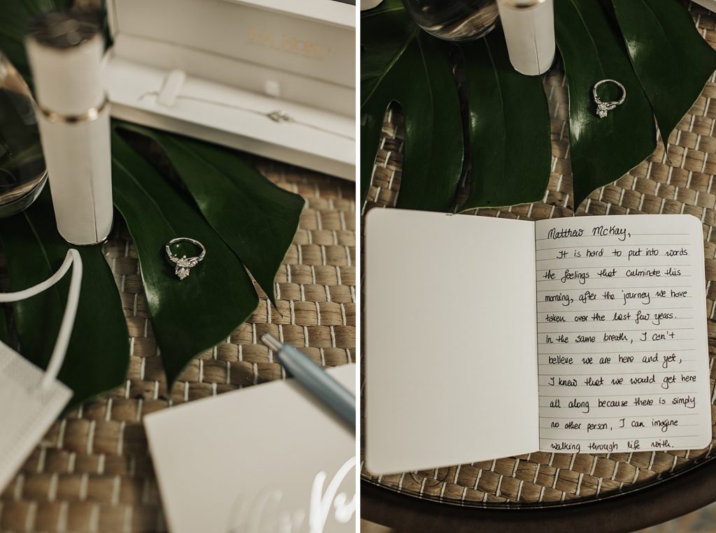 Detail shot of engagement ring and vow book